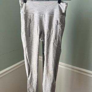 Running tights with zipper pockets - large enough to hold your phone.